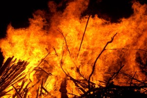 A yellow and orange inferno with a black sky backdrop